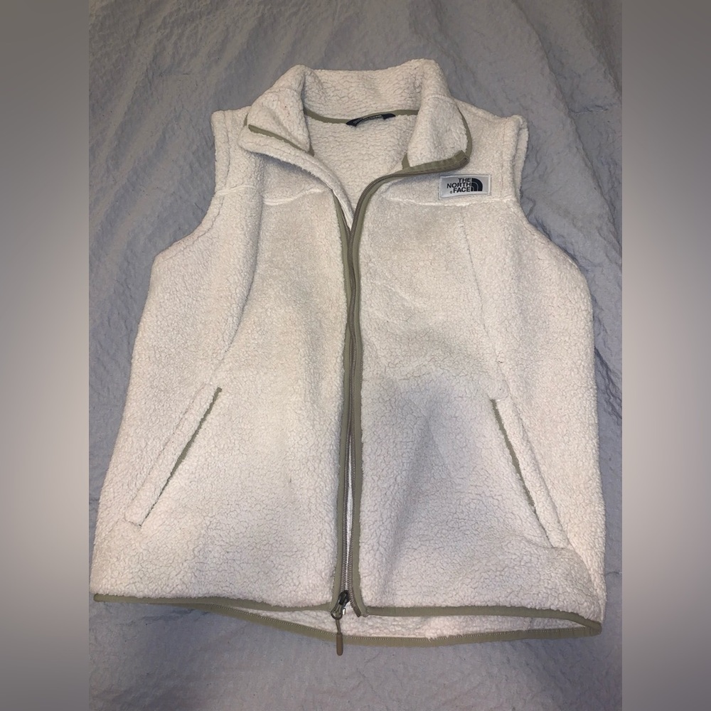 Size XL women’s North Face Sherpa vest. Cream/white in color.
